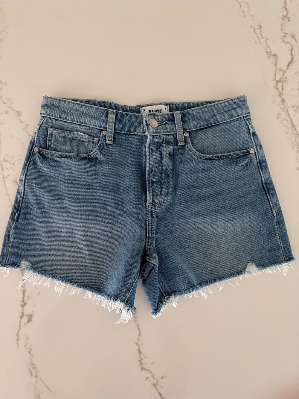 PAIGE Medium Blue Frayed Hem Denim Shorts